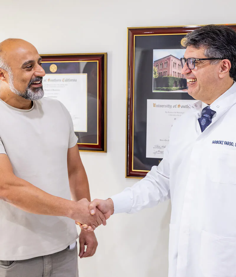 man shaking hand with Dr. Farsio at Farsio Dental Specialty Group