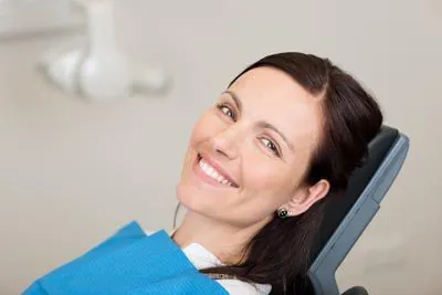 woman smiling during her visit to Farsio Dental Specialty Group