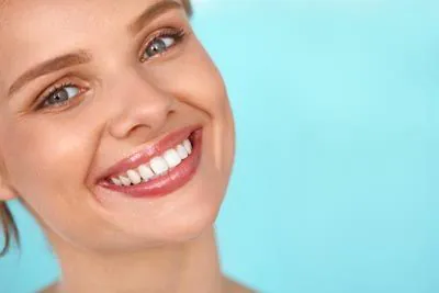 woman smiling after visiting Farsio Dental Specialty Group in Laguna Beach, CA