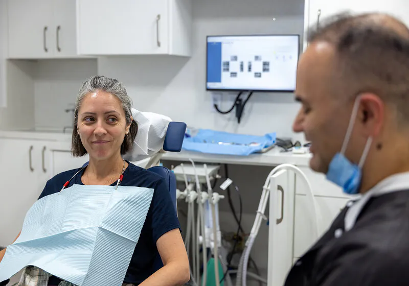 patient smiling during her visit to Farsio Dental Specialty Group